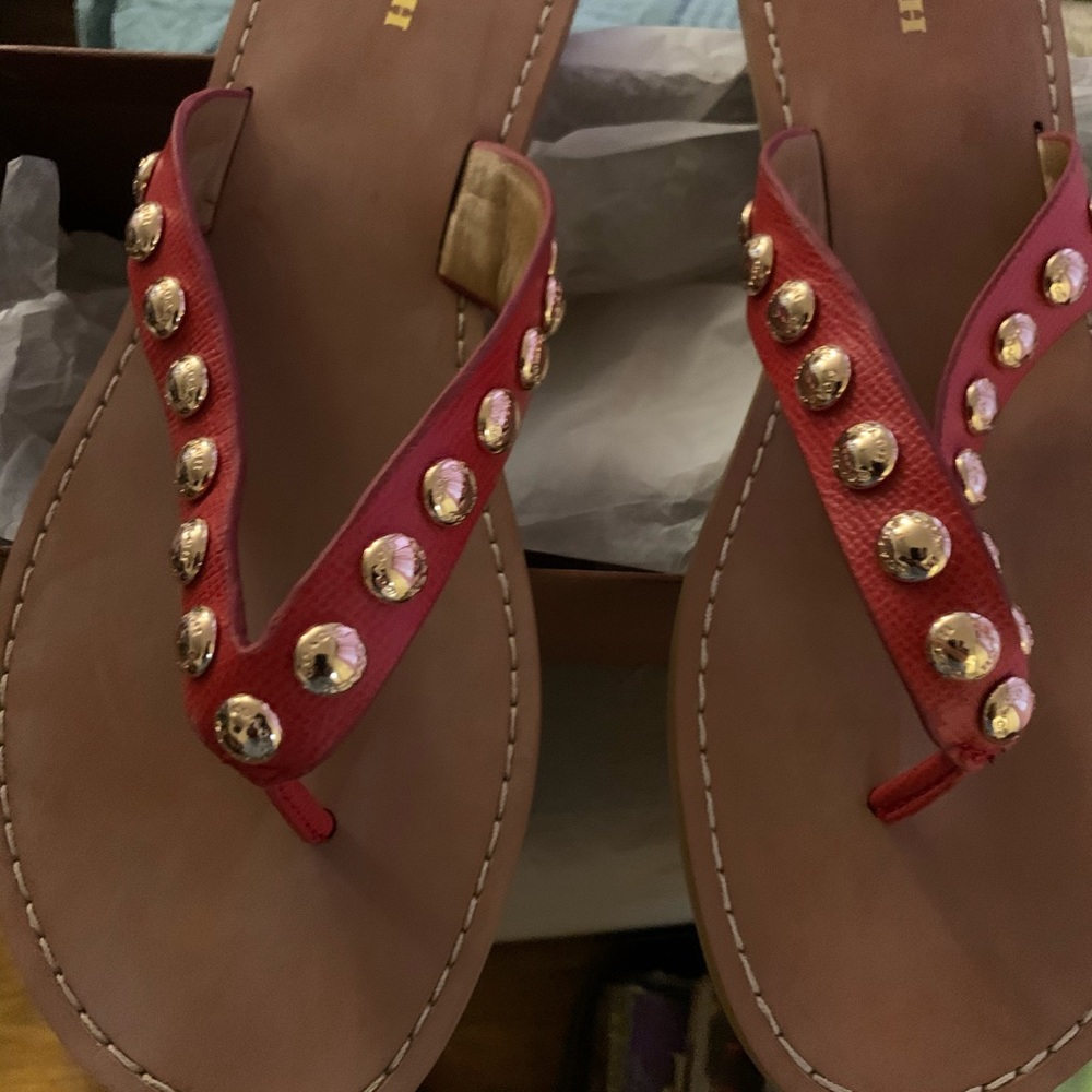 A pair of Coach sandals